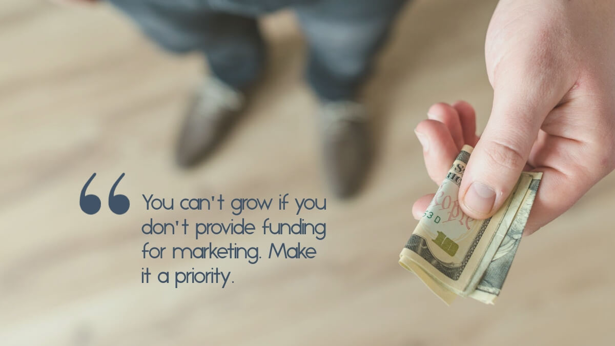 A man handing cash, with the caption, "You can't grow if you don't provide funding for marketing. Make it a priority."